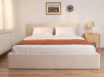 Čalouněná postel s úložným prostorem 180×200 cm Tilo Velvet – béžová
